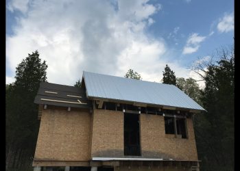 Insulating and Roofing a Timber Frame Cabin Roof Using Wrap and Strap and Galvalume